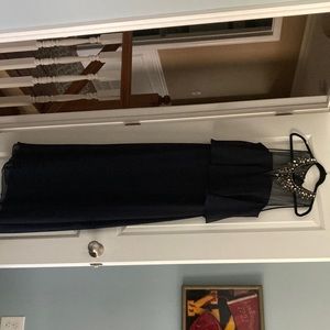 Mother of the bride dress. Navy with illusion jewel adorned neckline.